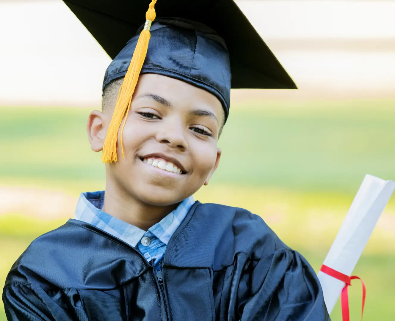 Young graduate smiling with diploma