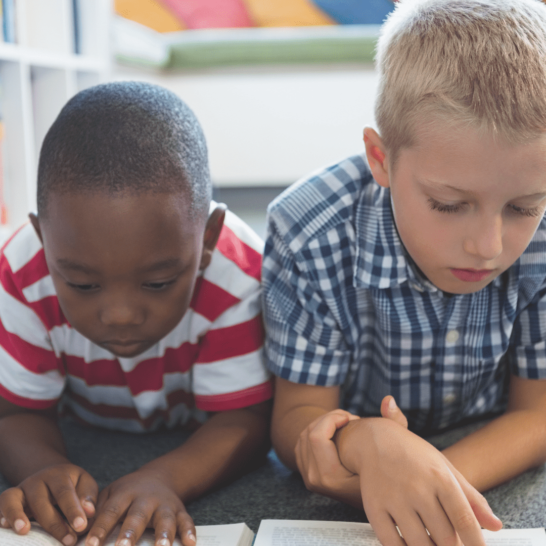 Young boys focused on reading books