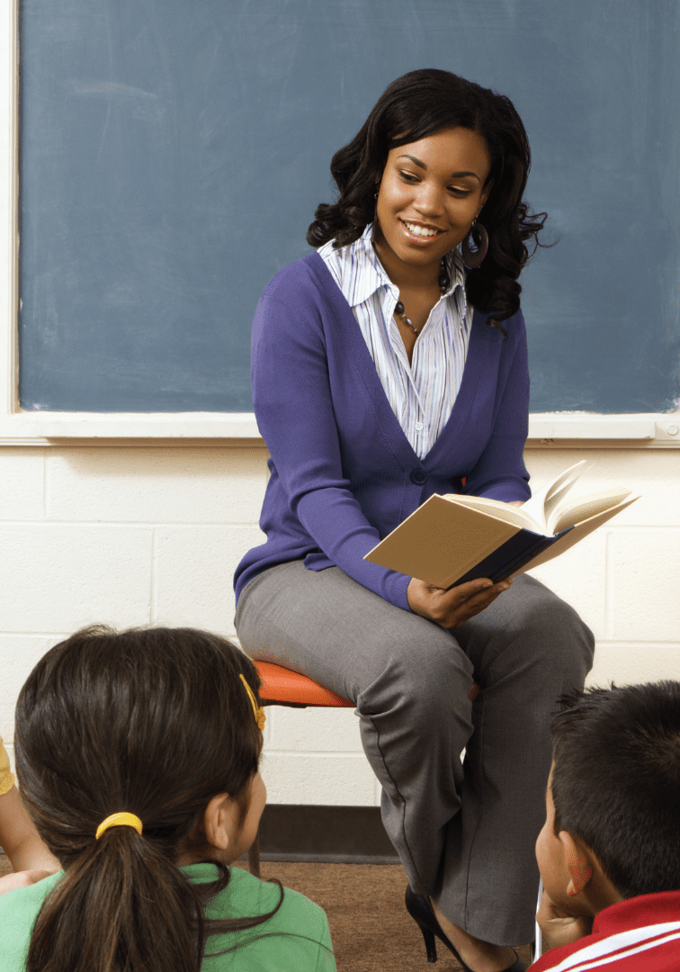Teacher reading to attentive students
