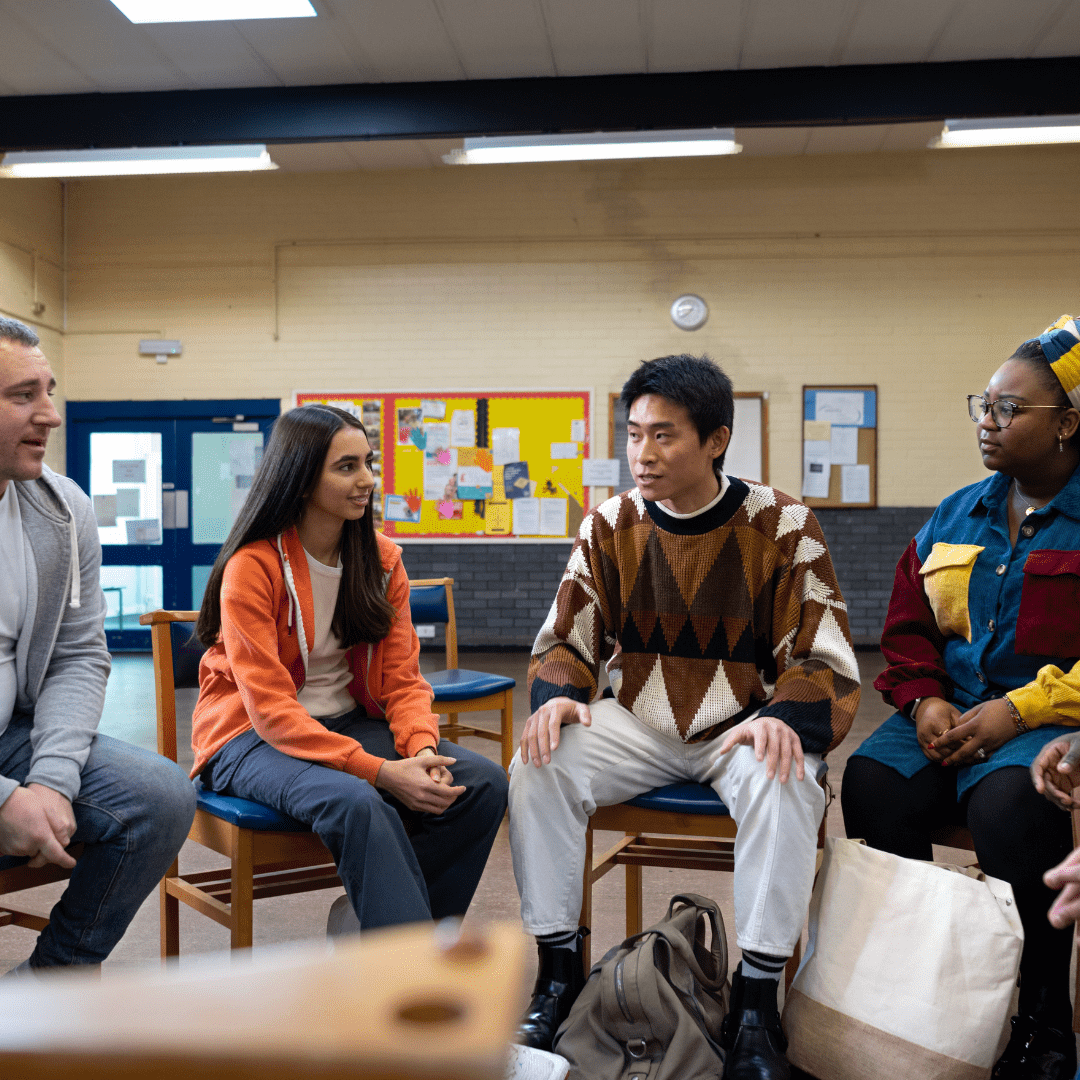 Diverse people engaged in conversation